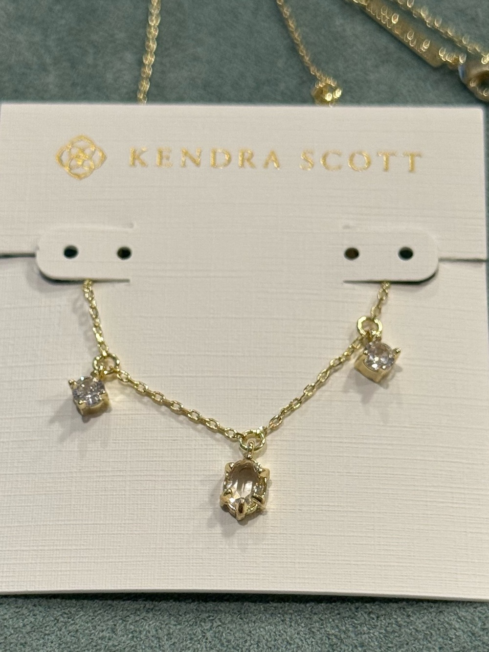Kendra Scott | 7-Stone Caitlin Gold Plated Necklace | Clear Stone Charms - Picture 3 of 4